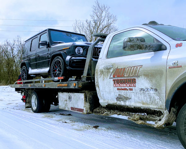 All Out Towing Nashville Flatbed Tow Truck Loaded with G Wagon
