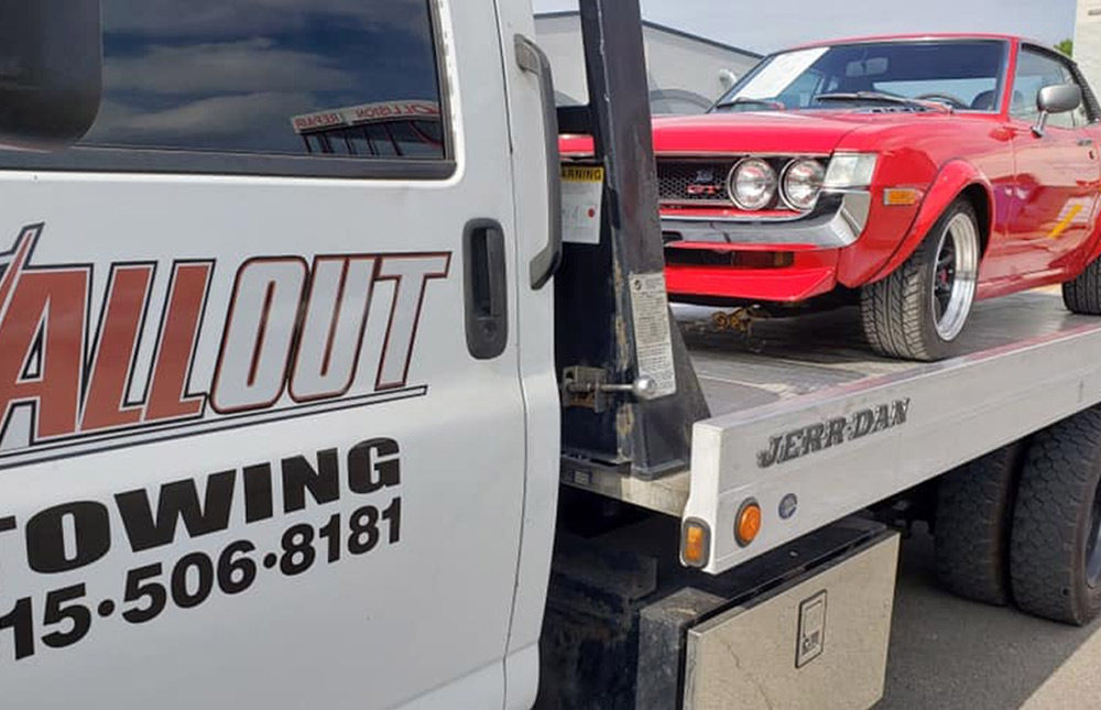 All Out Towing Nashville Flatbed Tow Truck Towing Red Sports Car