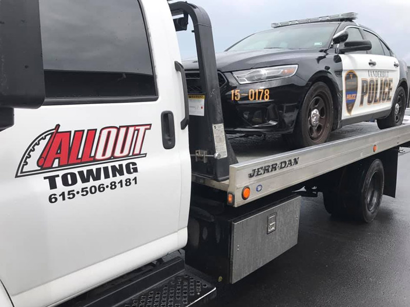 All Out Towing Nashville Police Cruiser towed on flatbed tow truck