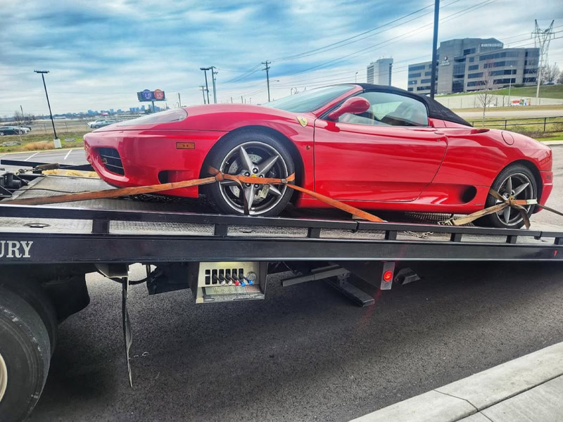 All Out Towing Nashville Red Sports Car on Flatbed Tow Truck