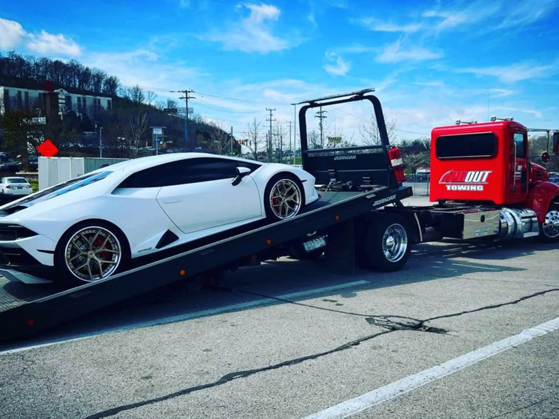 All Out Towing Nashville Tennessee White Sports Car on Flatbed Tow Truck